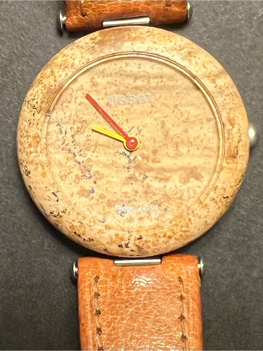 Tissot Beige Round Rock Watch with Red and Yellow Hands